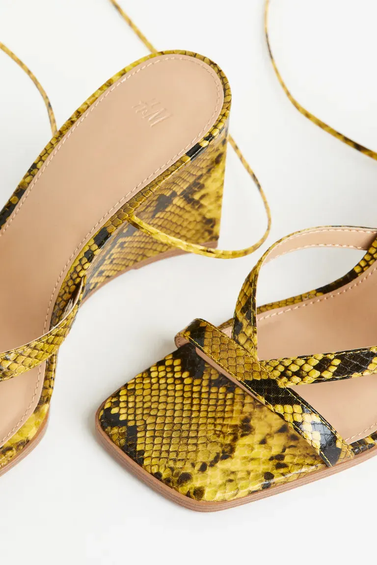 H&M wedge sandals, yellow/snake pattern