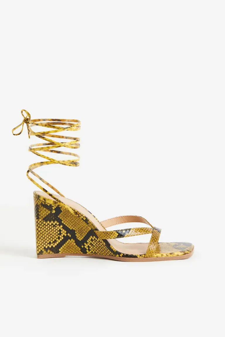 H&M wedge sandals, yellow/snake pattern
